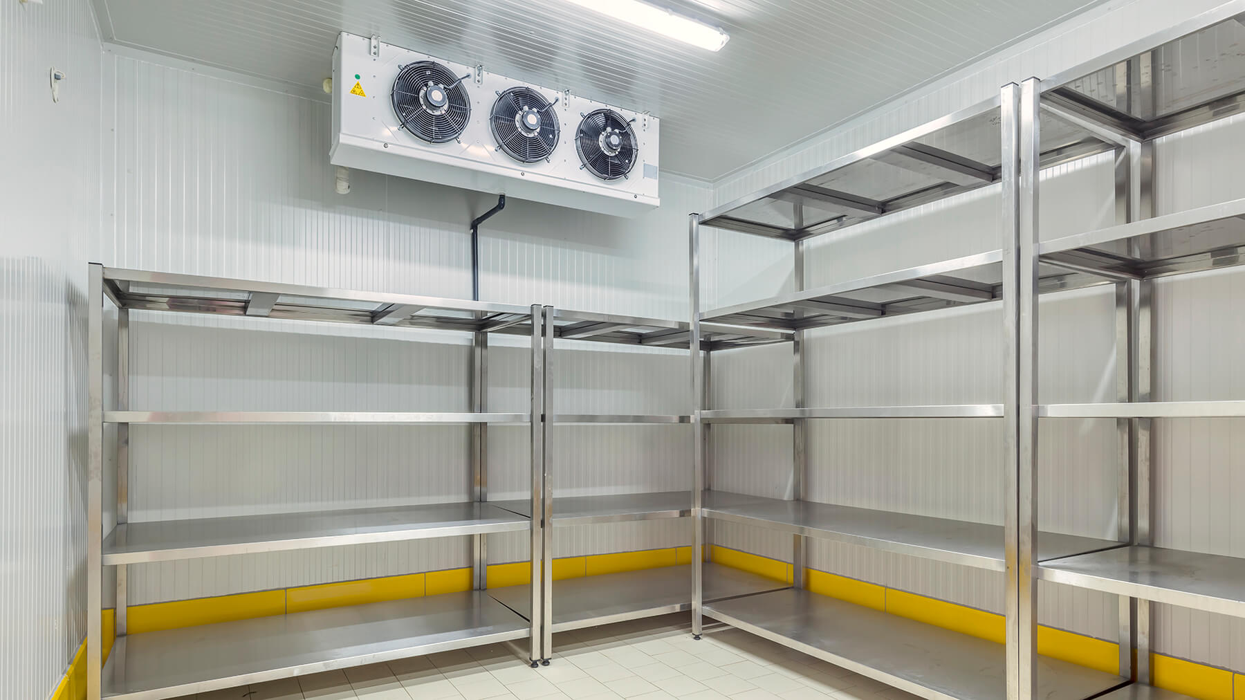 Interior of an empty commercial refrigeration room.