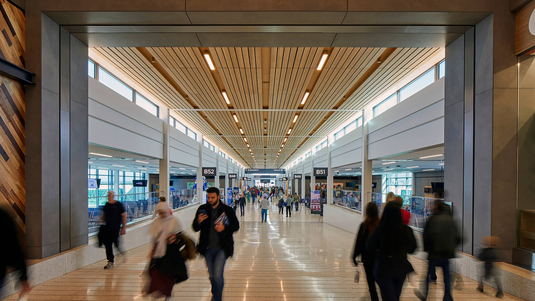 People walking to their gates at the new Kansas City International airport.