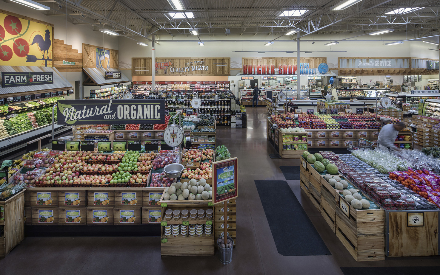 People shop inside the produce section of Sprouts Farmers Market.