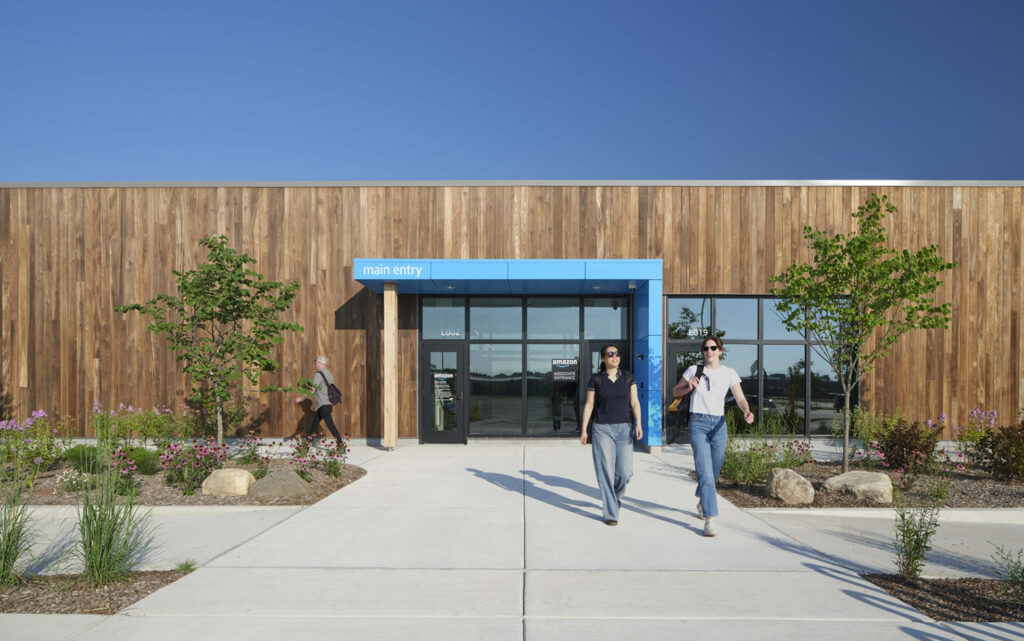 People walk out of Amazon's DII5 Delivery Station.