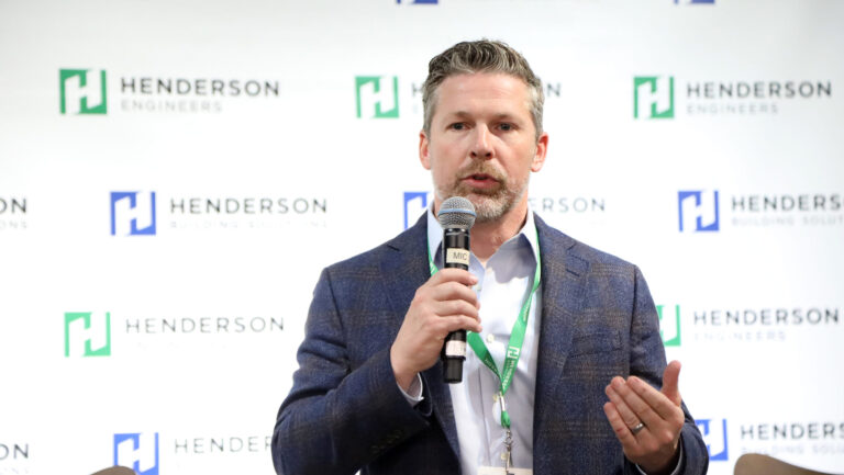 Photo of Brent Felten, business development director at Henderson Engineers, speaking into a microphone.