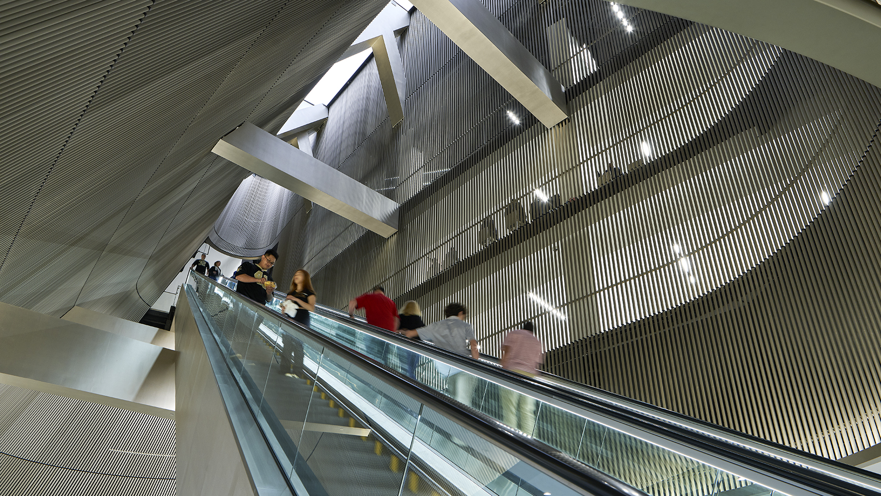 Fans riding an escalator in the Superdome.