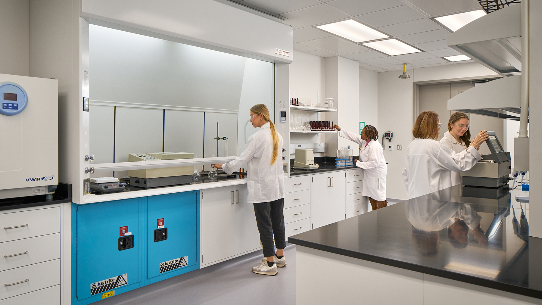 Interior of a science lab with scientists working.